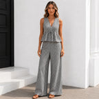 Women's black and white gingham sleeveless wide-leg pants two-piece set with a flattering peplum top.