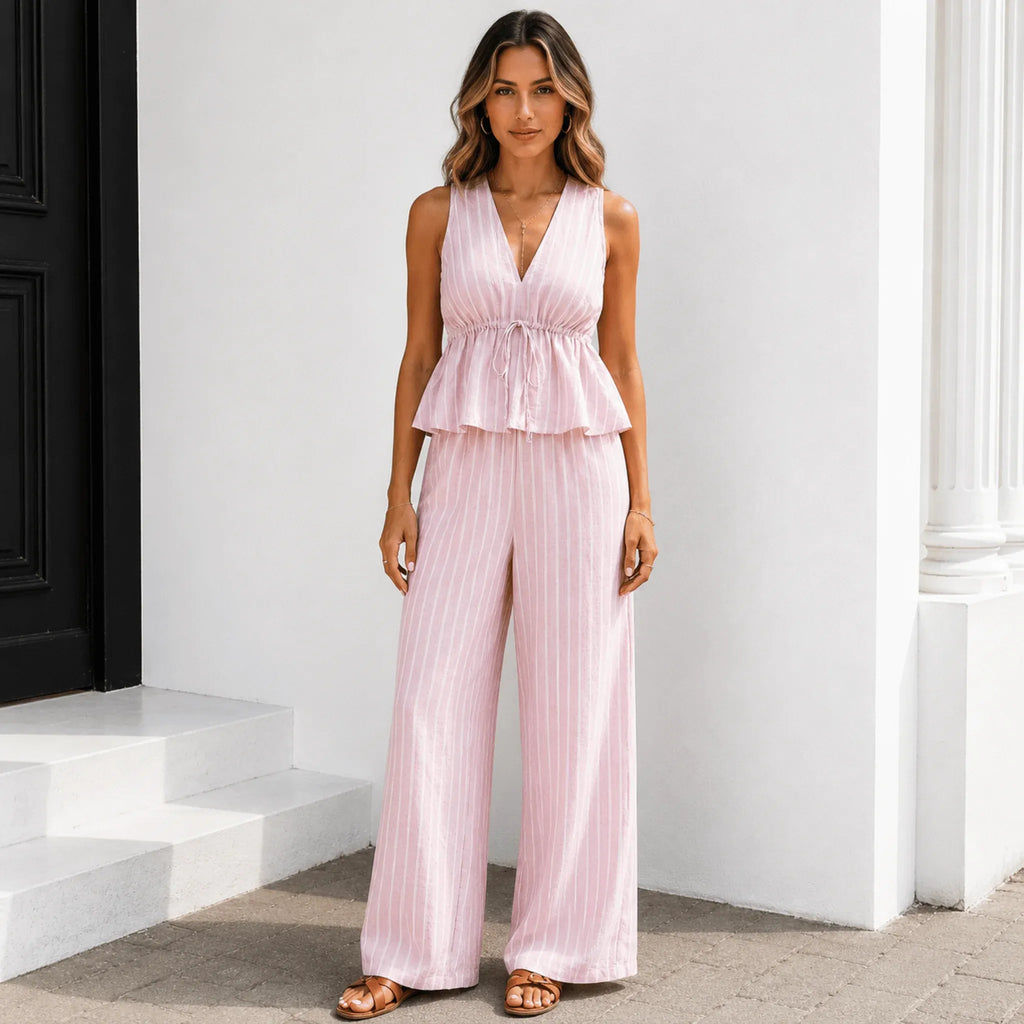 Women's sleeveless striped wide-leg pants two-piece set in soft pink with a relaxed peplum top.