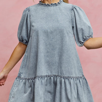 Close-up of the charming ruffled neckline on the SO ME denim mini dress.
