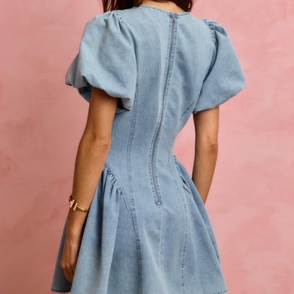 Back view of the SO ME light denim dress highlighting the zipper closure.