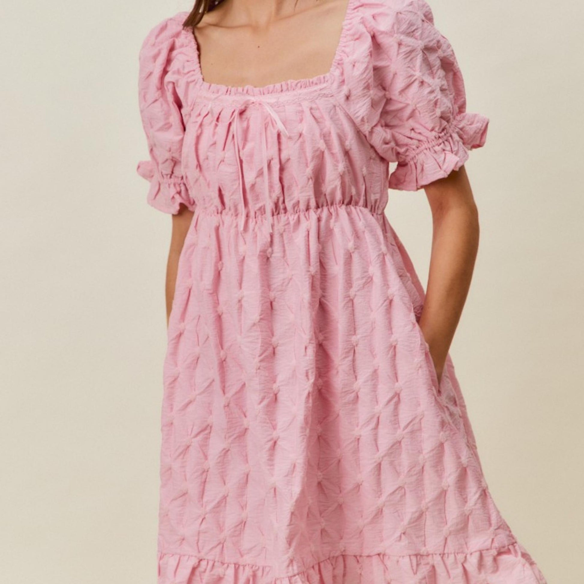 Full-length view of the romantic SO ME pink ruched bust mini dress.