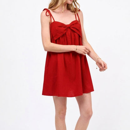 SO ME red ribbon bow strap mini dress — side view showing flowy fit.