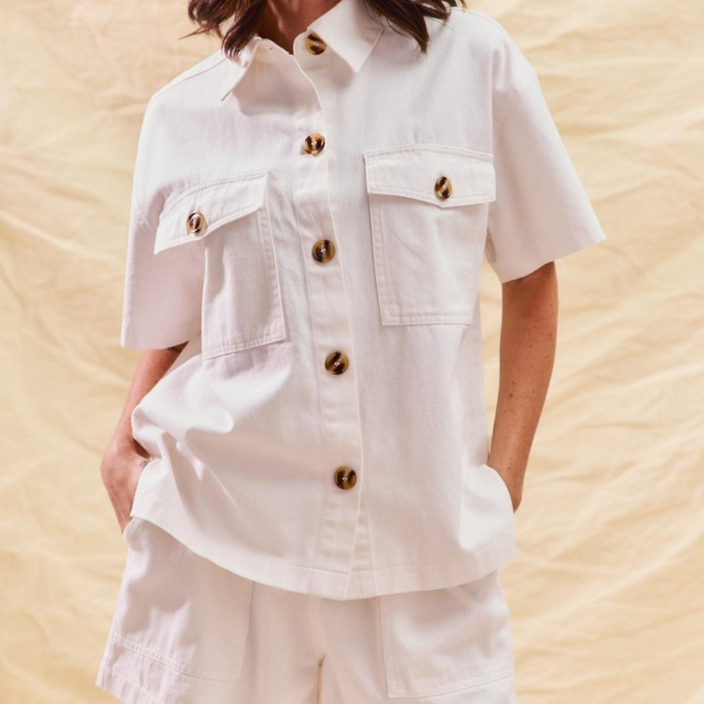 Front display of the SO ME off-white denim matching set with gold-tone button details.