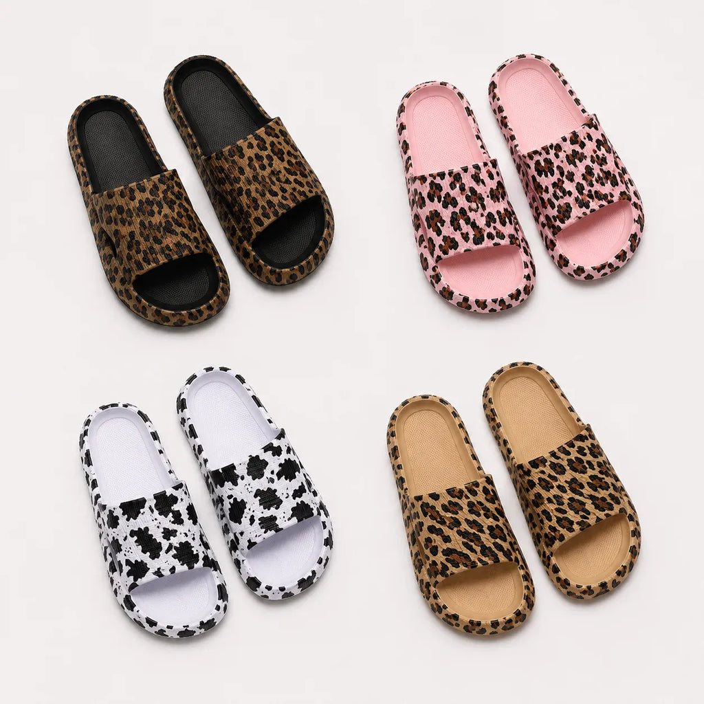 Women's Animal Print Comfort Slides available in black leopard, khaki leopard, pink leopard, and white cow print designs.