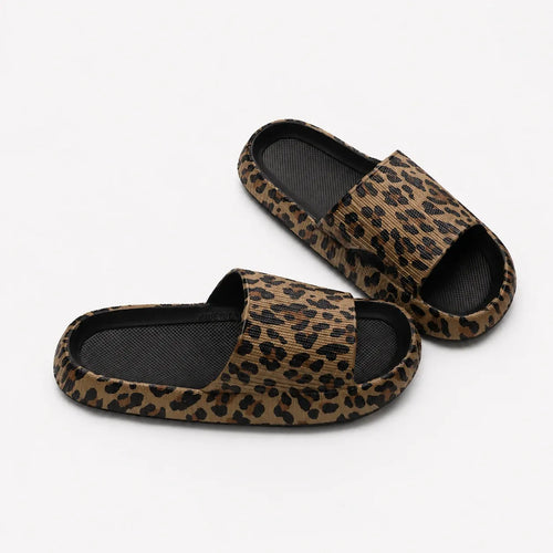 Women's black leopard print EVA comfort slides with a cushioned slip-on design for everyday comfort.