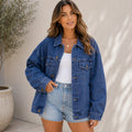 Women's Classic Relaxed Fit Jean Jacket in blue cotton denim featuring a relaxed fit, button-front closure, flap chest pockets, and long sleeves.