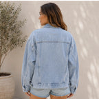 Back view of the women's Classic Relaxed Fit Jean Jacket in light blue showcasing the relaxed fit, structured yoke, and timeless denim design.