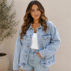 Women's Classic Relaxed Fit Jean Jacket in light blue cotton denim featuring a relaxed fit, button-front closure, flap chest pockets, and long sleeves.