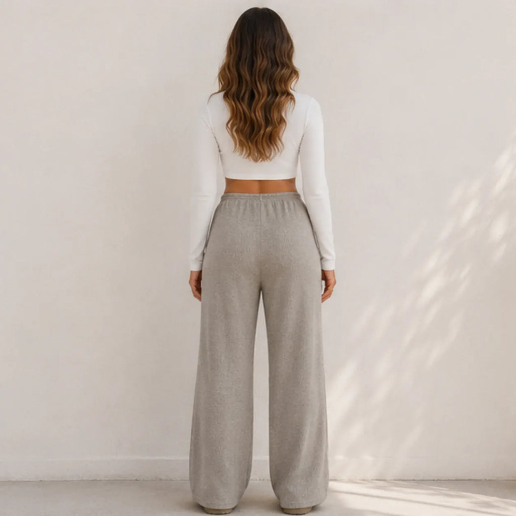 Back view of women's khaki wide-leg drawstring pants with elastic waist