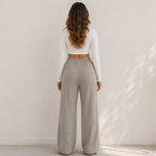 Back view of women's khaki wide-leg drawstring pants with elastic waist
