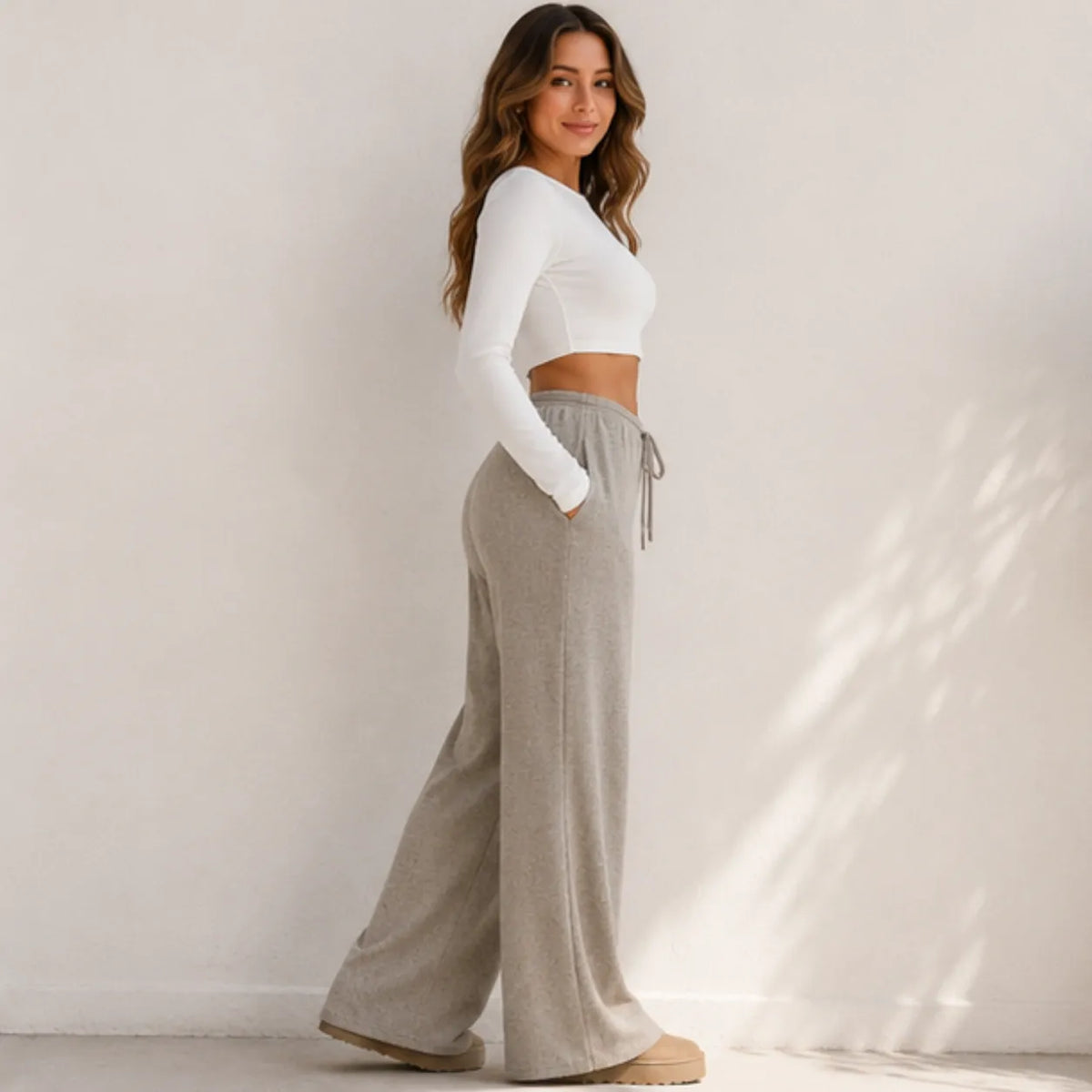 Side view of women's khaki wide-leg drawstring pants with relaxed fit
