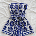 strapless-tie-waist-romper-blue-floral-print-flat-lay-solazura-boutique.webp