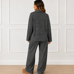Back view of the black striped collared long-sleeve top and wide-leg pants set