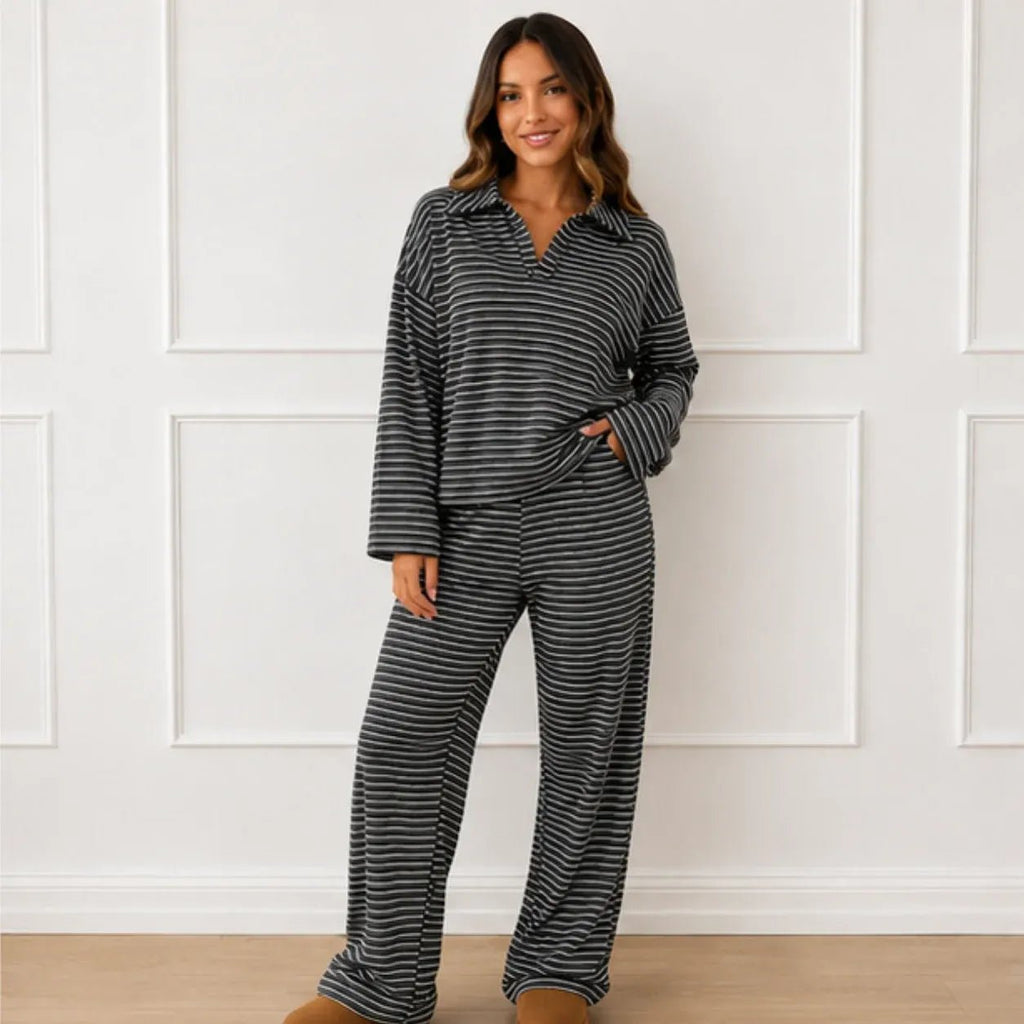 Front view of a woman wearing the black striped collared long-sleeve top and wide-leg pants set