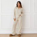 Woman wearing the khaki striped collared long-sleeve top and wide-leg pants set