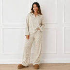 Woman wearing the khaki striped collared long-sleeve top and wide-leg pants set