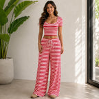 Model wearing the Striped Crop Top & Wide-Leg Lounge Set in red with a striped crop top and flowy wide-leg lounge pants.