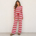 Woman wearing the red striped knit button-up top and wide-leg pants set