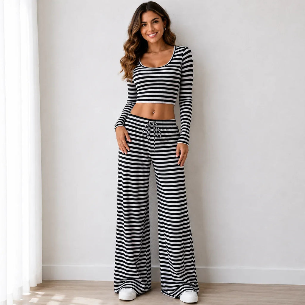 Black striped knit two-piece pants set with long-sleeve crop top and wide-leg pants