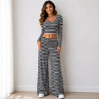 Black striped knit two-piece pants set with long-sleeve crop top and wide-leg pants