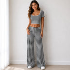 Black striped knit two-piece pants set with short-sleeve crop top and wide-leg pants