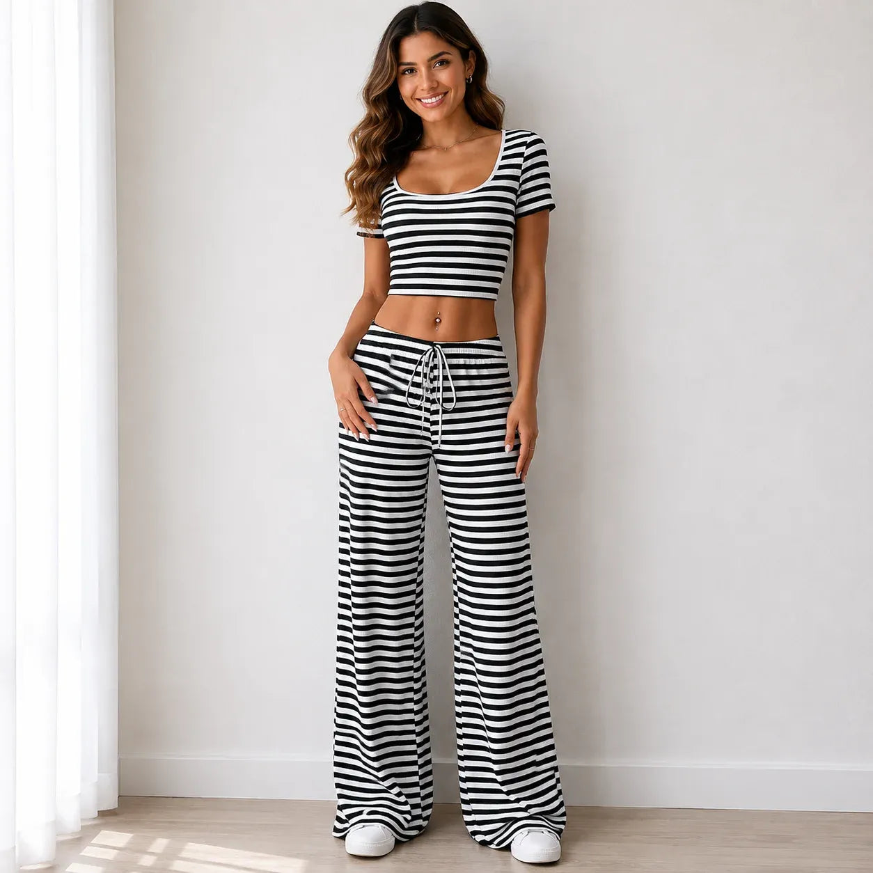 Black striped knit two-piece pants set with short-sleeve crop top and wide-leg pants