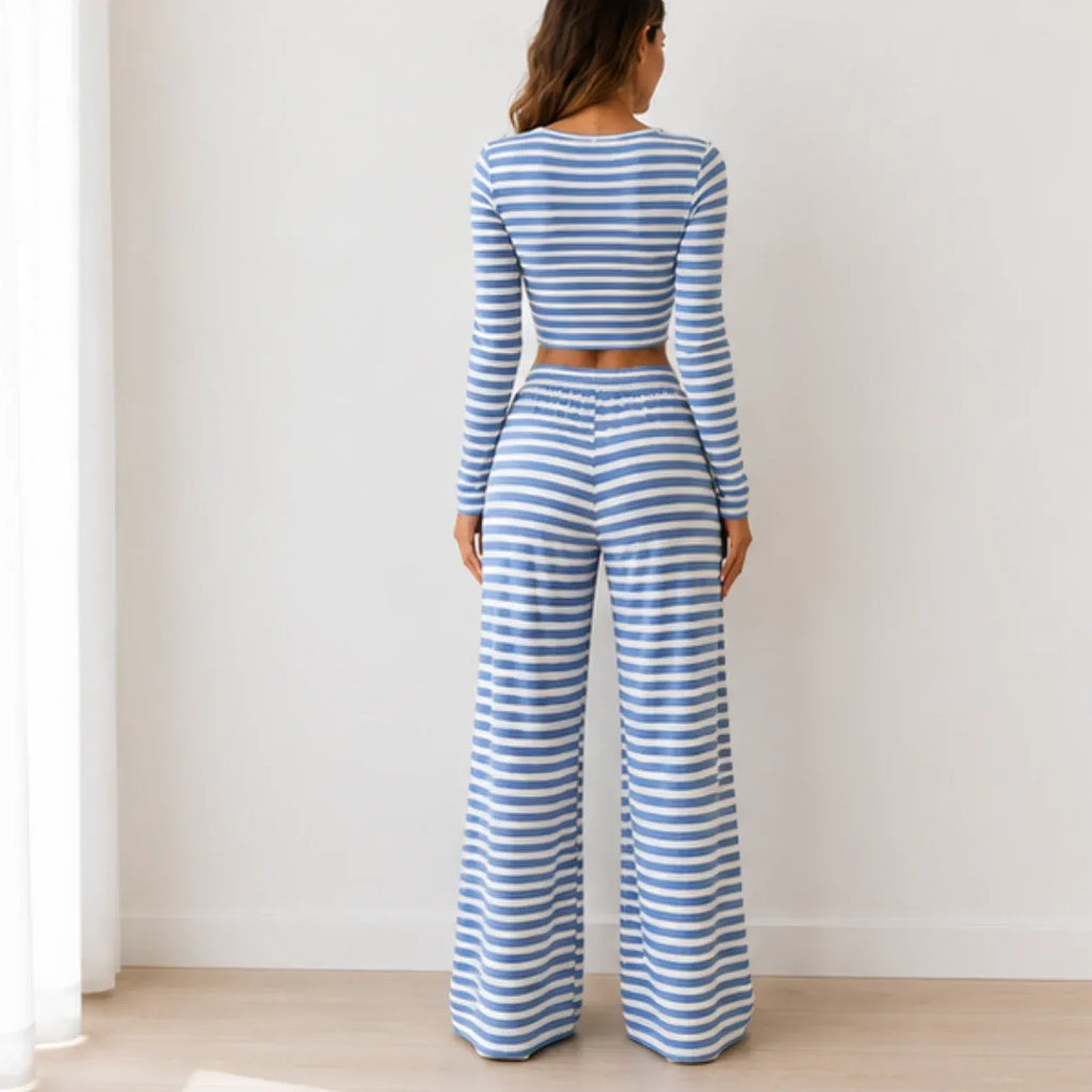 Back view of blue striped knit two-piece pants set with long-sleeve crop top and wide-leg pants