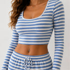 Close-up of blue striped knit crop top and drawstring waistband detail