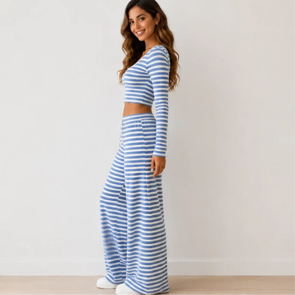 Side view of blue striped knit two-piece pants set with long-sleeve crop top and wide-leg pants