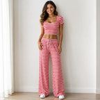 Red striped knit two-piece pants set with short-sleeve crop top and wide-leg pants