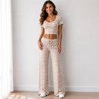 Tan striped knit two-piece pants set with short-sleeve crop top and wide-leg pants