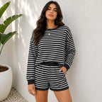 Black striped long-sleeve top and shorts two-piece set on Solazura model
