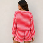 Back view of rose red striped long-sleeve top and shorts two-piece set