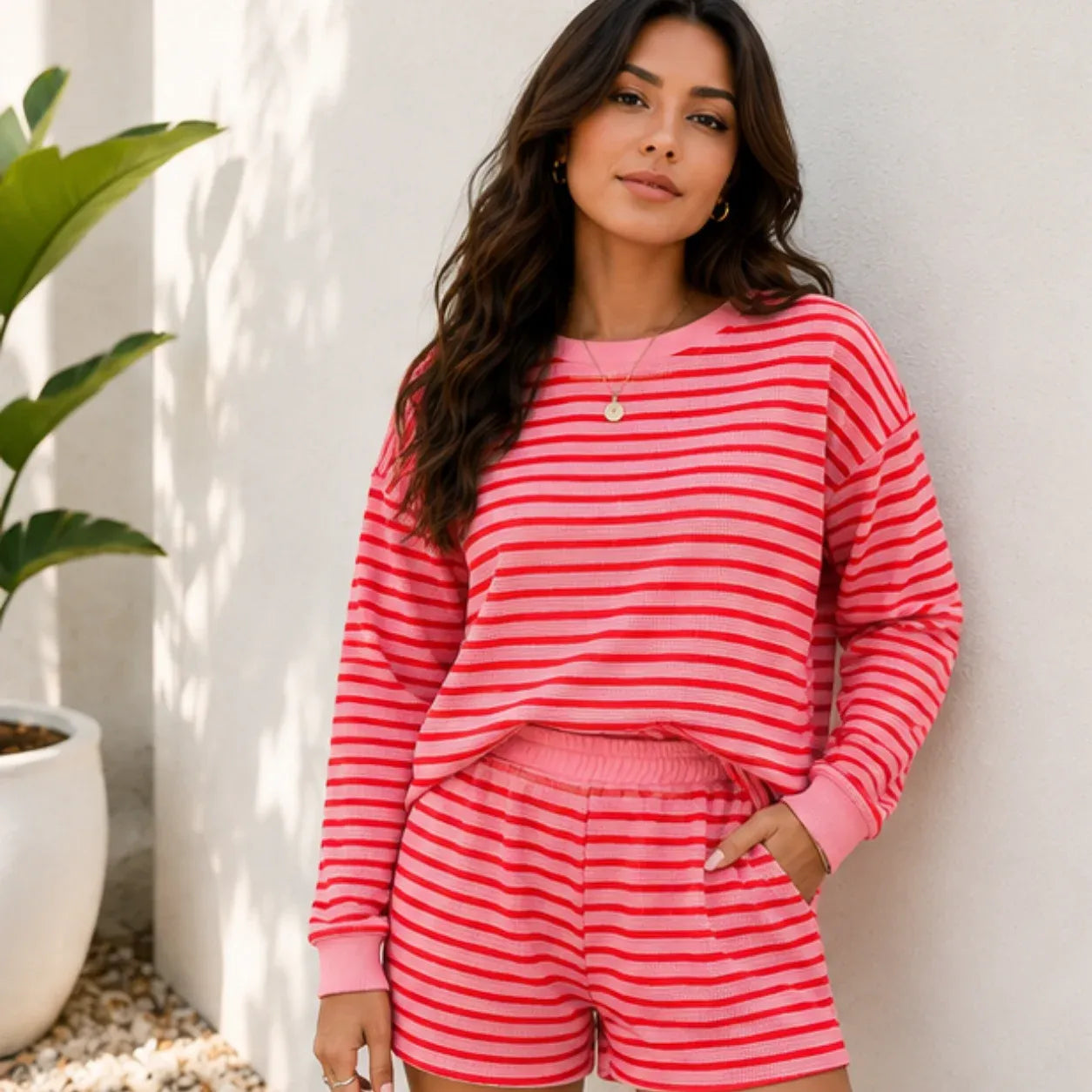 Rose red striped long-sleeve top and shorts two-piece set on Solazura model