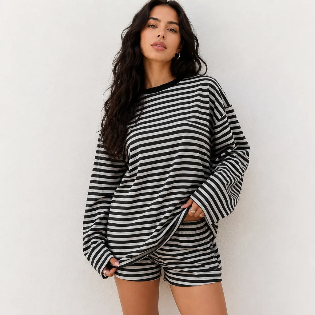 Woman wearing classic black and white striped relaxed two-piece shorts and top lounge set