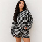 Woman wearing classic black and white striped relaxed two-piece shorts and top lounge set