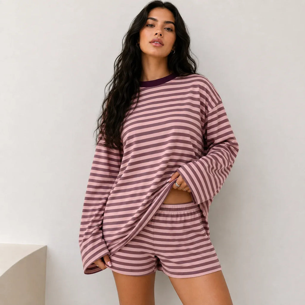 Woman wearing dusty pink and deep brown striped two-piece lounge shorts set