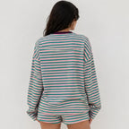 Back view of women's relaxed fit pink and teal green striped long-sleeve lounge shorts set