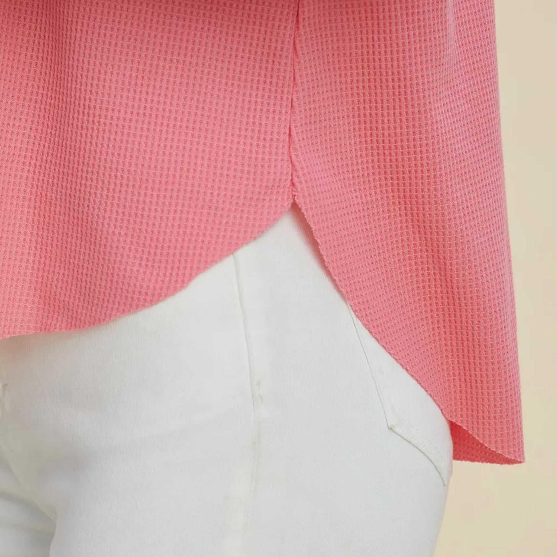 Close-up detail of the soft, textured fabric on the pink Double Take hoodie for a cozy feel.