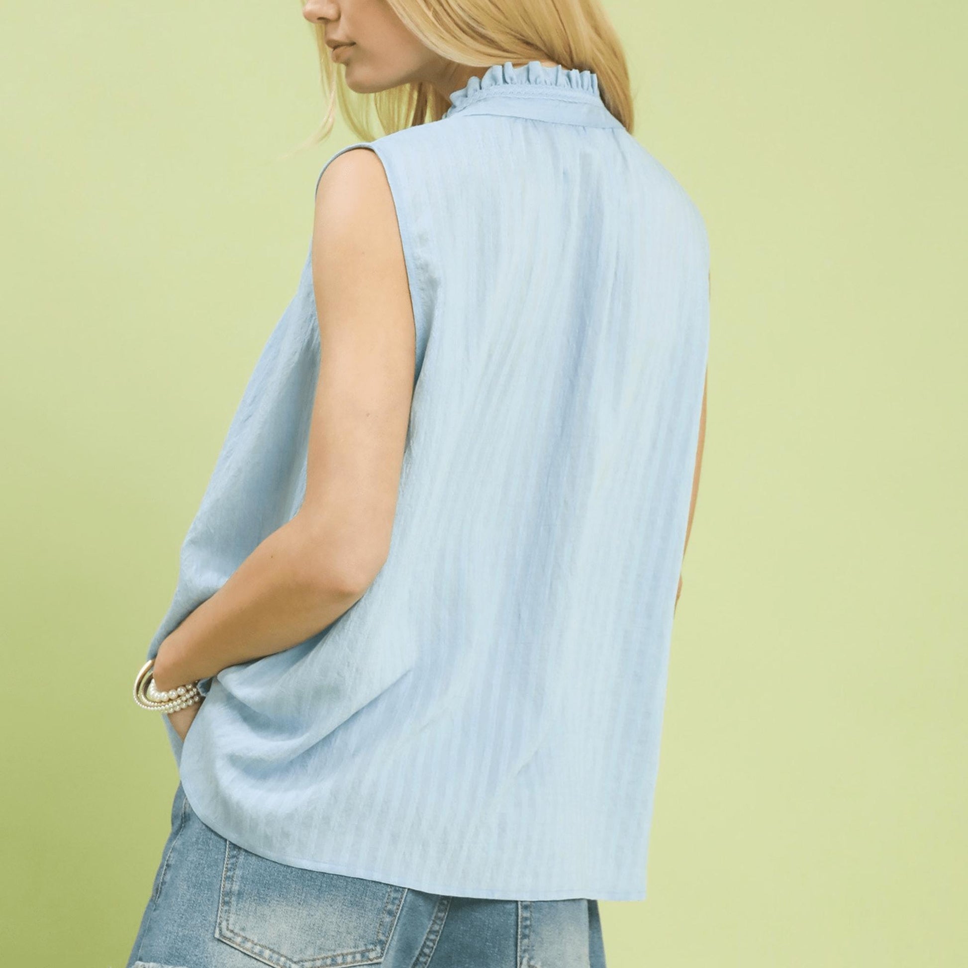 Back view of the peri blue sleeveless top highlighting the breathable gauze fabric.