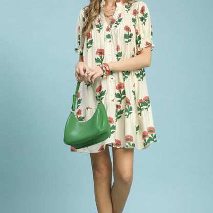 Full-length view of the Umgee floral print babydoll dress showcasing the flowy tiered hemline.