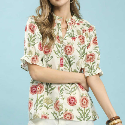 Front view of the Umgee floral button front short sleeve top in a vibrant red and green print.