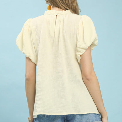 Back view of the Umgee Cream boho top highlighting the airy, oversized silhouette.