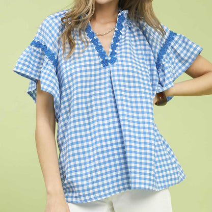 Front view of the Umgee blue and white gingham top with lace trim.