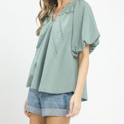 Side view of the Umgee mint blue boho blouse showing the relaxed, flowy silhouette.
