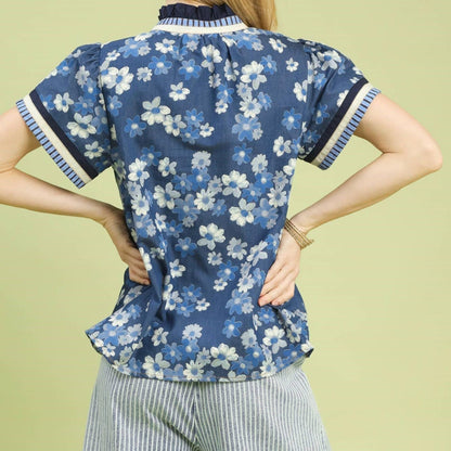 Back view highlighting the modern gray and white striped fabric and relaxed fit of the Umgee top.