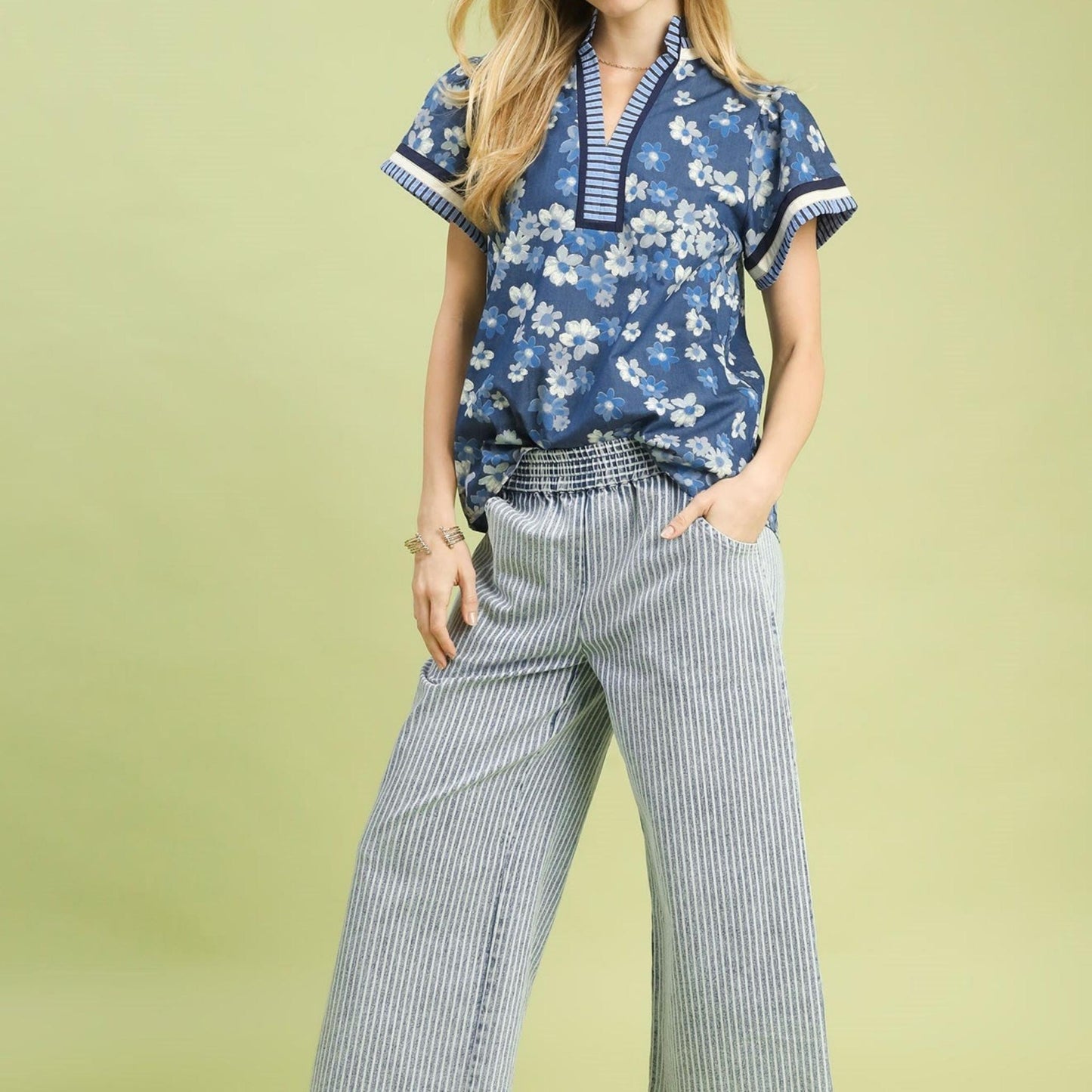 Lifestyle shot of the Umgee mixed media top styled with denim for a casual summer look.