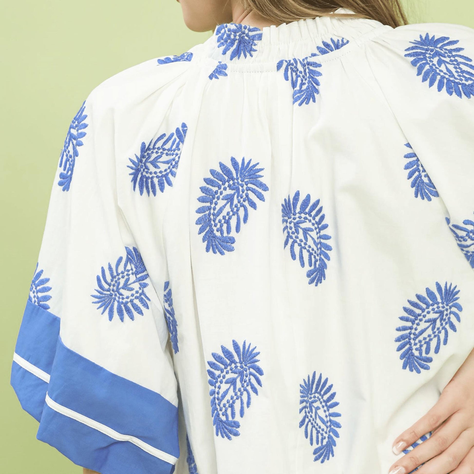 Close-up of the intricate paisley embroidery and V-neckline on the Umgee boho dress.