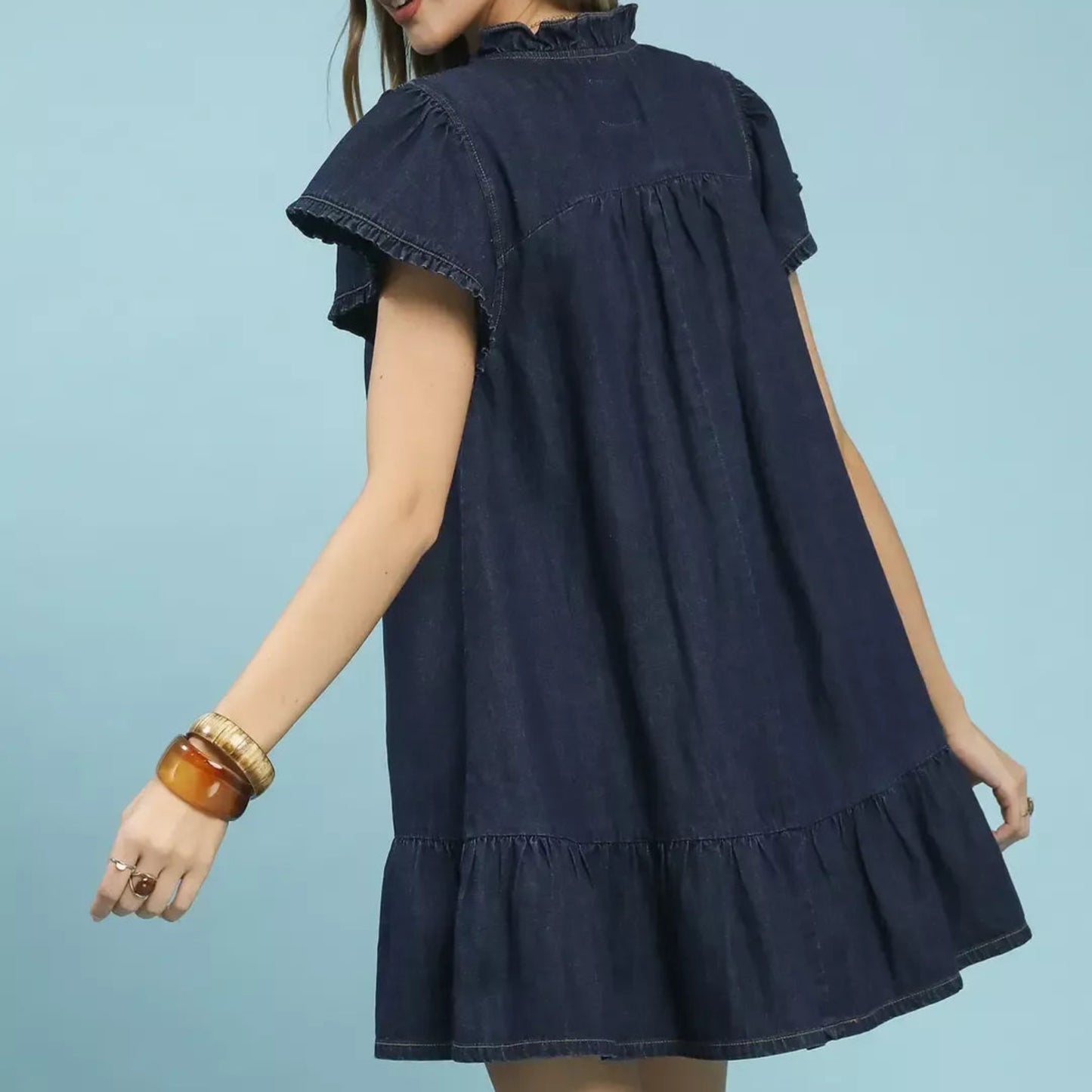 Back view of the umgee ruffled washed denim dress highlighting the vintage washed cotton fabric