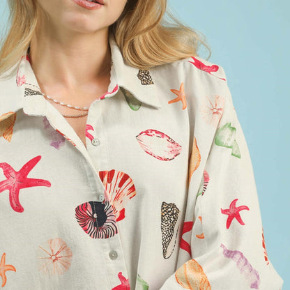 Close-up of the button-down front and the charming seashell and starfish print details.